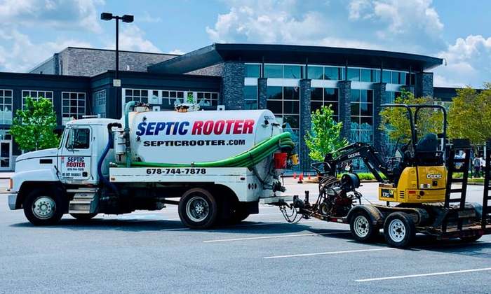 SepticRooter™ service truck and excavator on a septic repair job in Bartow County, Georgia
